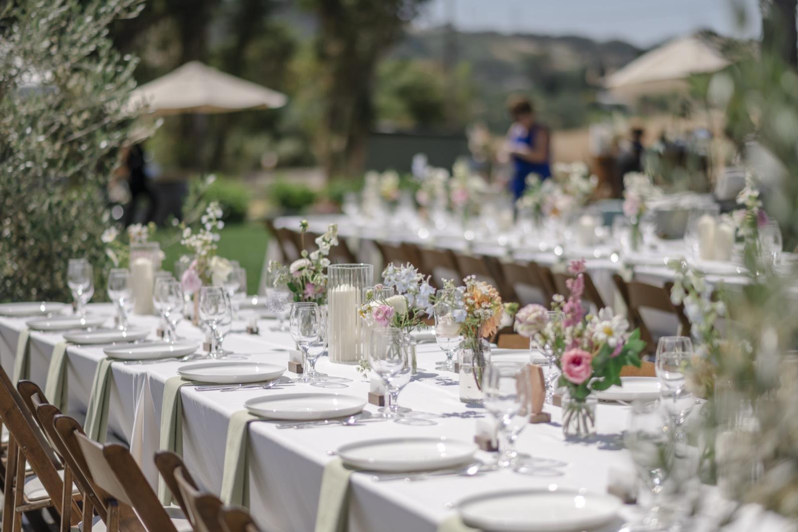 A long table set for a farm gathering